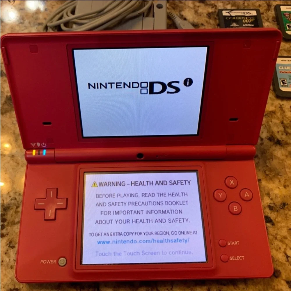 DS Pink Console, Stylus  Pen, Four (4) Games & Charger